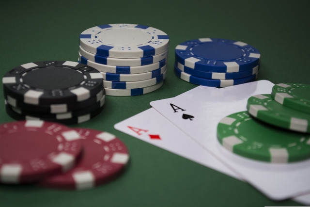 Blackjack cards and casino chips on a gaming table
